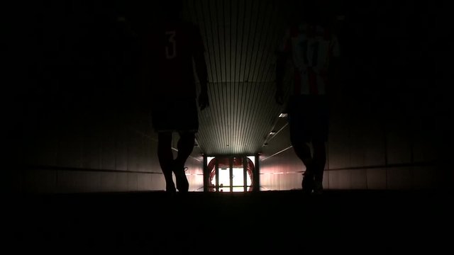 Football players go out to play football at the stadium