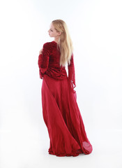 beautiful lady with long blonde hair wearing a red medieval fantasy gown. standing, isolated on white background.