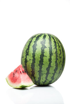 watermelon with one slice standing isolated on white background
