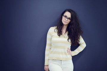 Secretary or business woman with suprised look on her face isolated over dark background