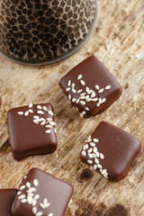 Handmade chocolate candies with sesame seeds
