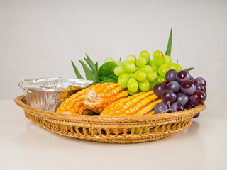 Fruits and vegetables corn, grapes, pandan in tray