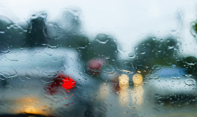 View From The Car Glass On The Rainy Day With Motion Blur Effect And Selective Focus
