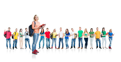 Fototapeta premium Large group of teenage students isolated on white background. Many different people standing together. School, education, college, university concept.