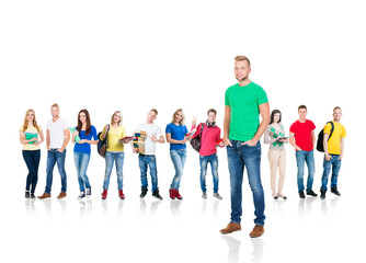 Obraz premium Large group of teenage students isolated on white background. Many different people standing together. School, education, college, university concept.