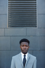 Young lawyer in suit and tie looking at camera