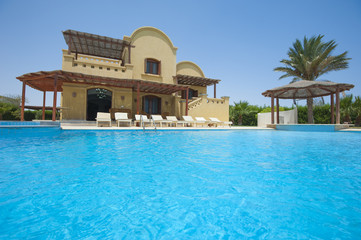 Swimming pool at at luxury tropical holiday villa