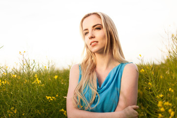 Young beautiful woman in the fields