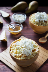 Millet porridge in bowls with honey