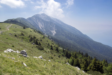 Fototapeta na wymiar Touristic trail Alta Via del Monte Baldo, ridge way in Garda Mountains