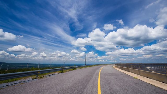 4k Time-lapse of asphalt road with blue sky