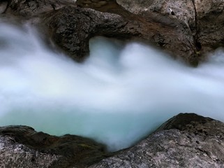 Water Rushing Through Rocks - 167817914