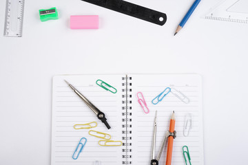 Back to School concept. Studying elements on a white background in a top view or flat lay