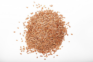 close up of flax seeds isolated on white background. top view