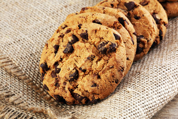 Chocolate cookies on wooden table. Chocolate chip cookies shot