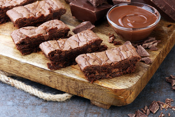 Brownie stack, chocolate cake on rustic wooden board