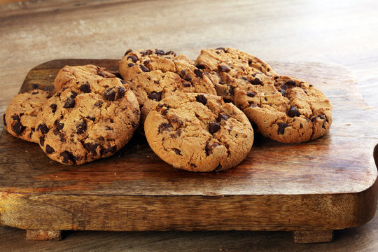 Chocolate cookies on wooden table. Chocolate chip cookies shot