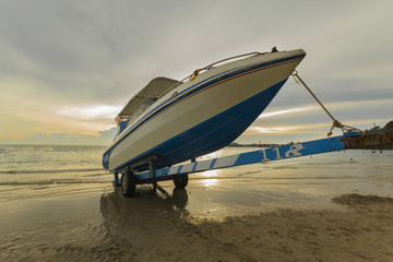speed boat park on the boat trailers at beautiful sunset environment