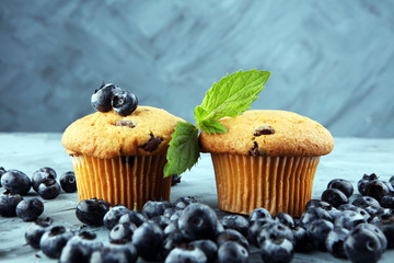 Freshly baked blueberry muffins with fresh blueberries