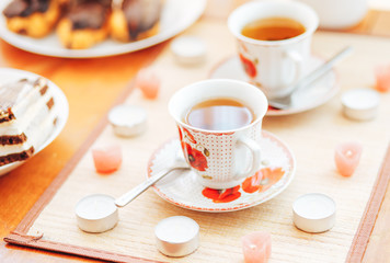 Cake and two cups of tea on the table. Beautiful composition. Breakfast.