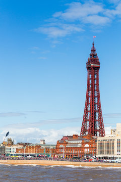 Blackpools famous tower on the waterfront under a blue sky