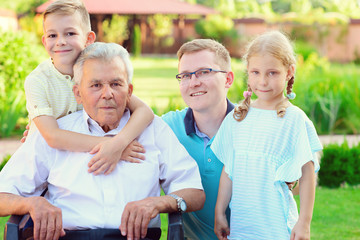 Fototapeta premium Portrait of happy old grandfather and cute children