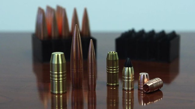 Various types of bullets on table, close up