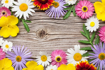 Fototapeta premium Garden flowers on wood