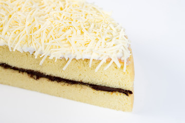 cheese cake whole with chocolate filling on a white plate