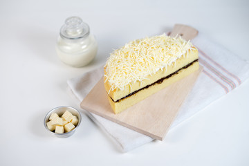 cheese cake whole with chocolate filling on a white plate