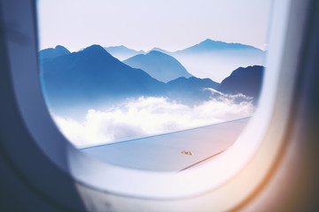 White blue night sky as seen through window of an aircraft. 