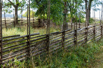 Traditional old wicker fence in countryside of  Sweden