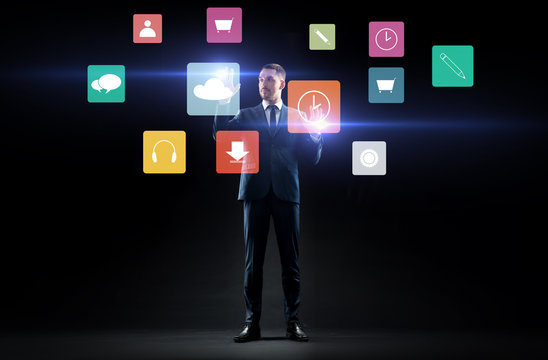 businessman with menu icons on virtual screen
