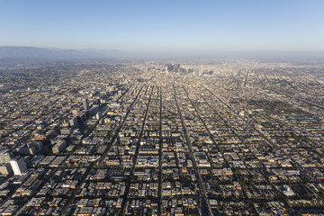 Smoggy summer afternoon aerial view of the Mid City, Koreatown and Downtown areas of Los Angeles in...