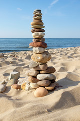 tower of rocks on beach