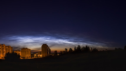Panorama of noctilucent clouds in the night sky