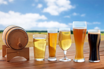 different types of beer in glasses on table