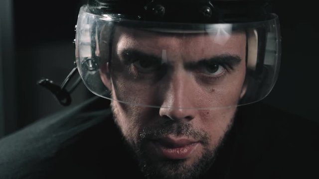 Hockey player portrait close up with helmet, professional forward defender in dressing room before game, canadian hockey agressive power portrait