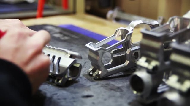 Manufacturing metal barrels for guns, close up