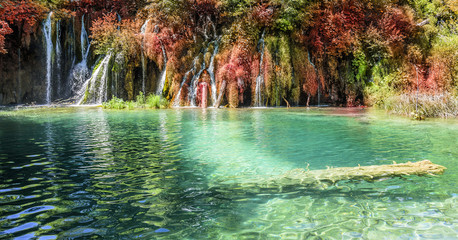 Waterfall in autumn forest at National Park Plitvice Lakes.