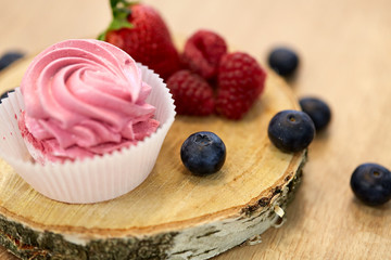 zephyr or marshmallow with berries on stand
