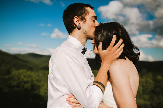 Couple Kissing on Mountaintop