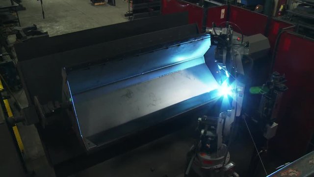 Machine uses welding torch in factory