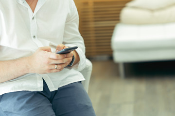 Man using smartphone at coffee shop