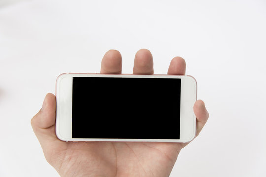 White smartphone in mans hand