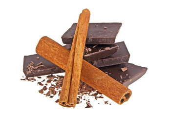 Dark chocolate bars and cinnamon sticks isolated on a white background