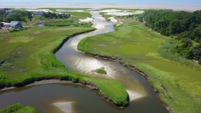 Aerial View of Channel Winding Through Cape Cod Marsh