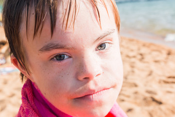 Boy With Downs Syndrome at the Beach
