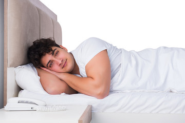 Man in bed suffering from insomnia