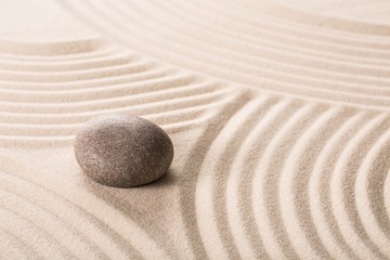 Fototapeta na wymiar Stone on sand.